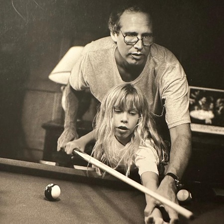 Cydney Cathalene Chase learning pool from her father Chevy Chase.